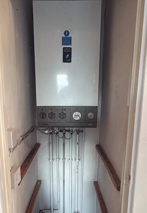 Old Worcester Bosch boiler with multiple faults in a Tamworth cupboard before replacement with a new Worcester Bosch 4000 combi