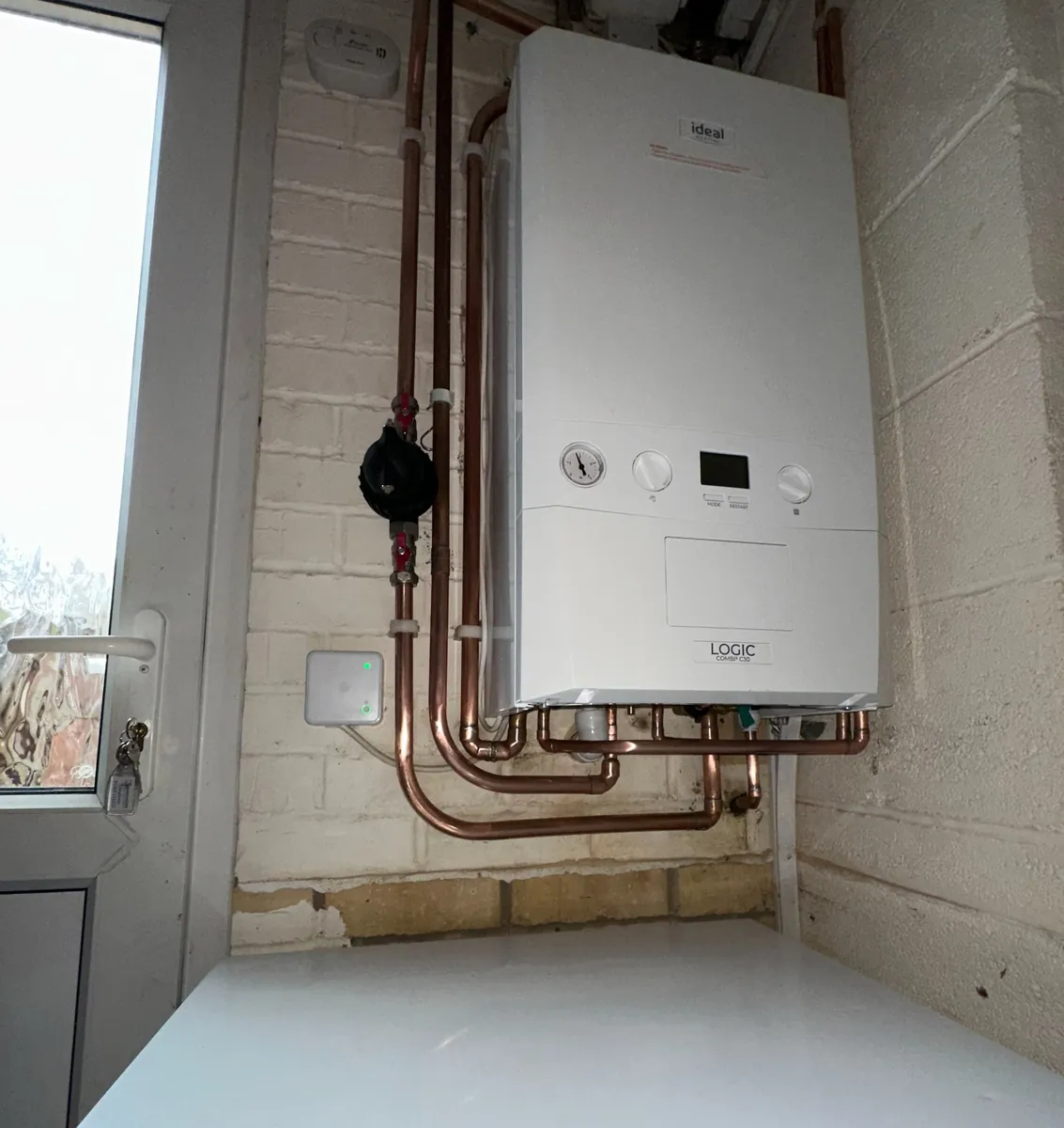 Betaflo boiler installation showing heat exchanger pipework and system controls
