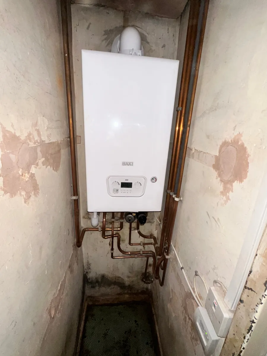 Betaflo combi boiler installed in an airing cupboard with tidy copper pipework