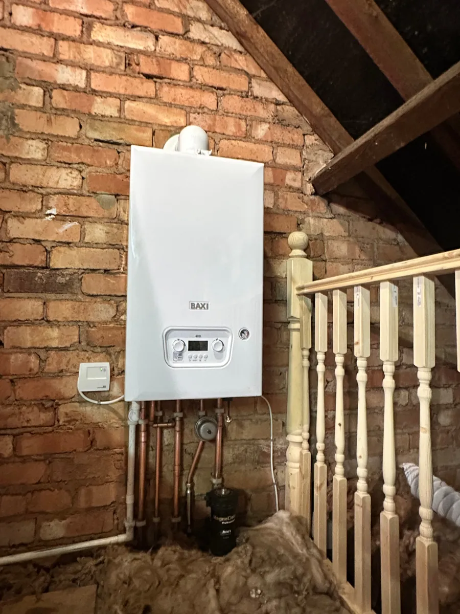 Baxi 400 combi boiler installed by BetaFlo on exposed brickwork in a Tamworth loft conversion